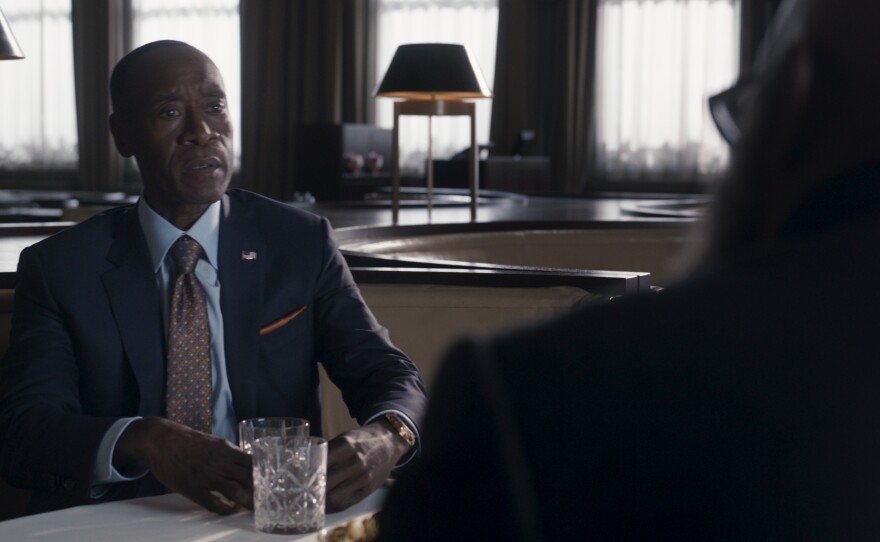 Don Cheadle as James 'Rhodey' Rhodes and Samuel L. Jackson as Nick Fury.