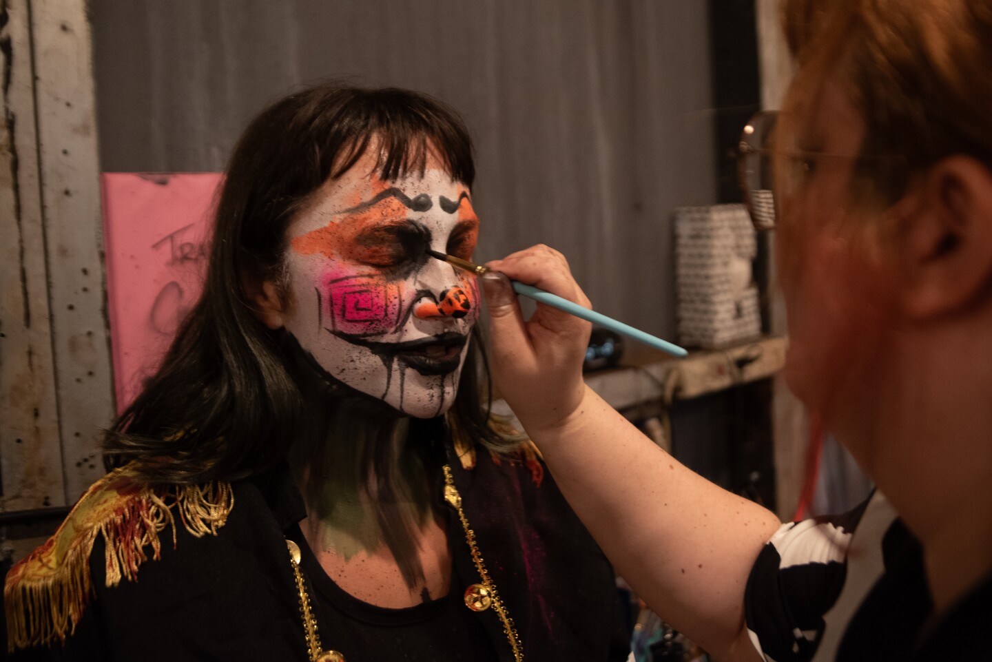 Scare actor Malory Knezha getting some detail work on her makeup at The Haunted Trail in Balboa Park on Sept. 25, 2025.