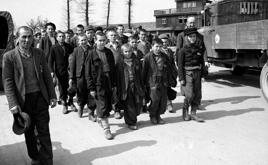 Children and other prisoners liberated by the U.S. Army march from Buchenwald concentration camp in April 1945. The tall youth in the line at left, fourth from the front, is Elie Wiesel.