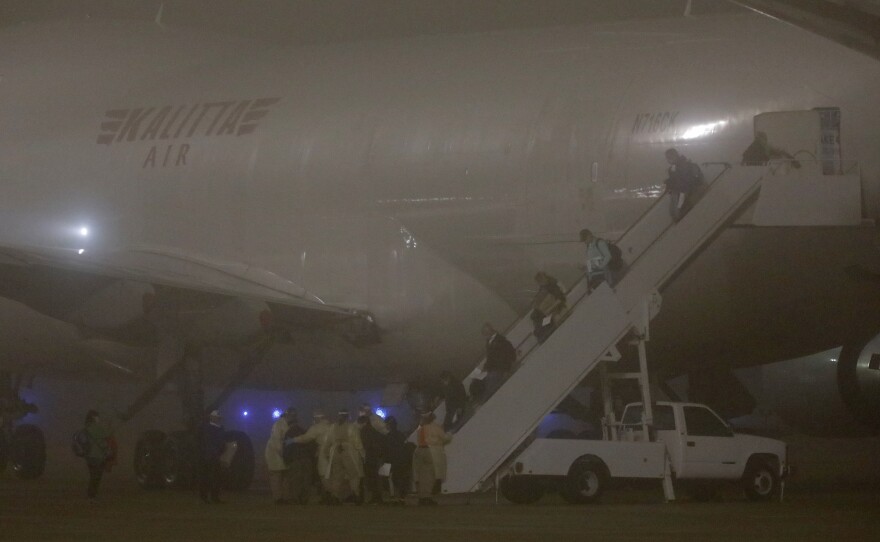 American evacuees from the Diamond Princess cruise ship arrive at Joint Base San Antonio-Lackland on Monday in San Antonio, Texas.