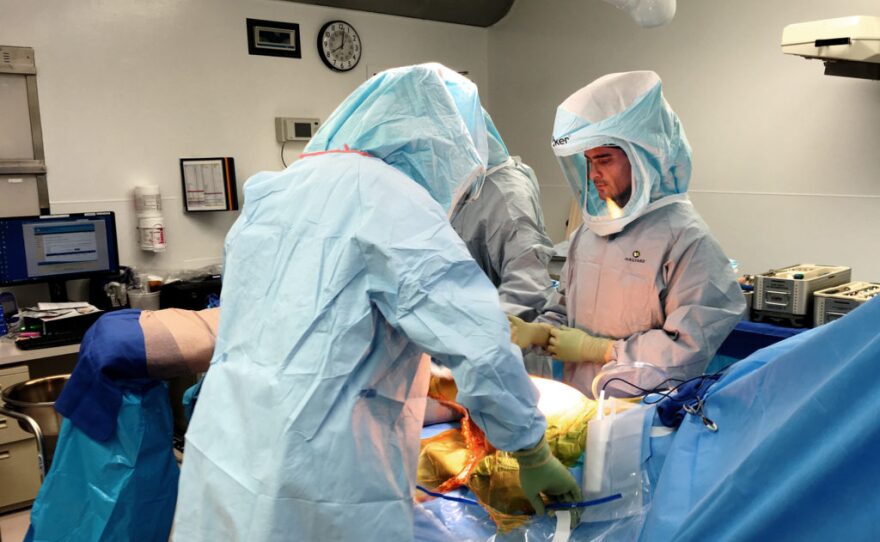 A surgical team including Dr. Nikita Bezrukov, left, and Dr. Ian Foran, right, performs a hip procedure on a patient at UCSD’s Thornton Hospital, Feb. 3, 2017. Thornton Hospital is not among the worst for deaths of hip fracture patients.