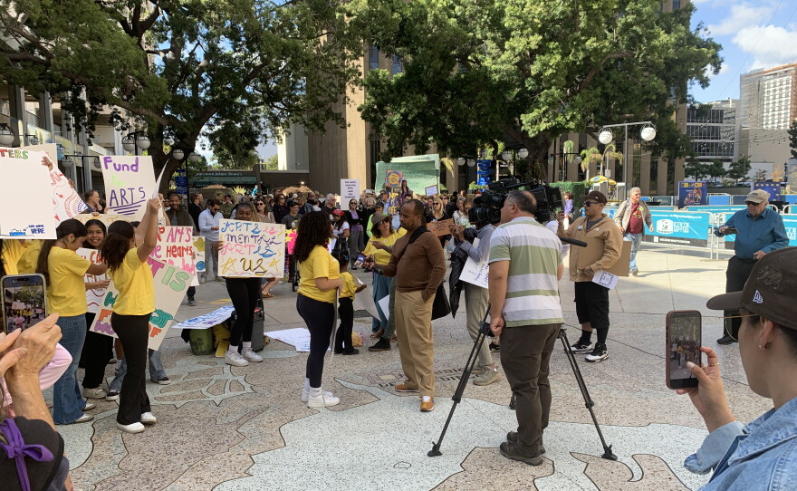 Arts community members rally at Civic Center Plaza before the City Hall budget review committee meeting, May 27, 2026.