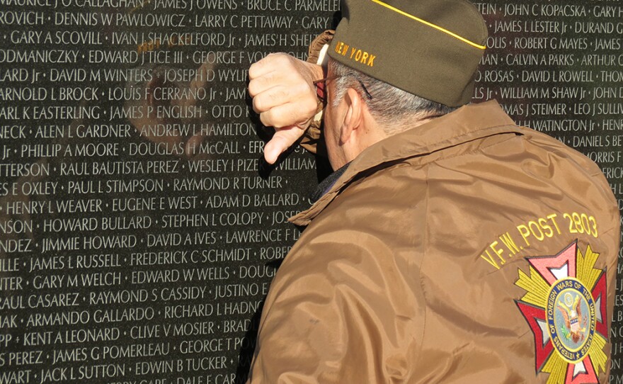 A veteran visits the Vietnam Veterans Memorial in Washington, D.C.