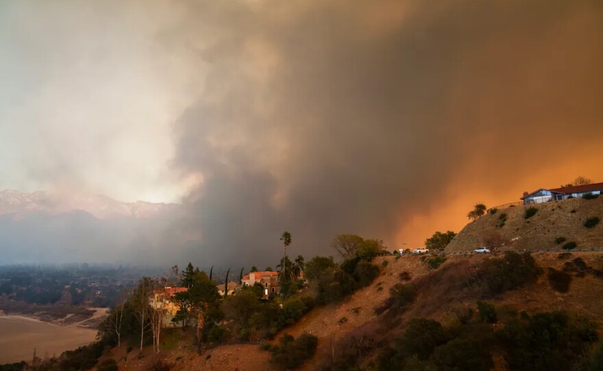Smoke from the Eaton Fire fills the sky in La Cañada Flintridge on Jan. 8, 2025. Hills and canyons are critically dry.