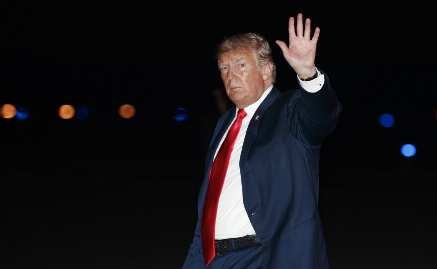 President Trump boards Air Force One on Saturday in New Jersey, the day before he reiterated his stance that the focus of Donald Trump Jr.'s 2016 Trump Tower meeting was to collect incriminating information on presidential opponent Hillary Clinton.