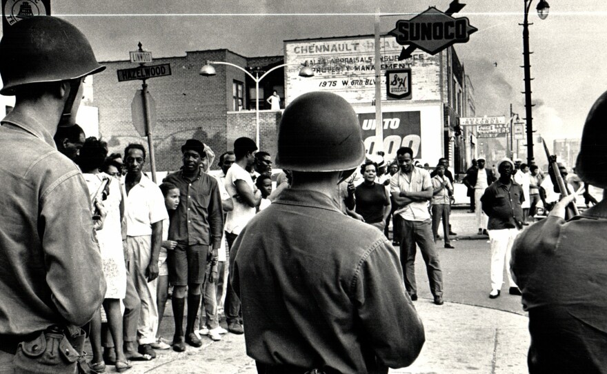 Troops on Detroit’s Linwood Avenue in July 30, 1967. Mich., U.S.