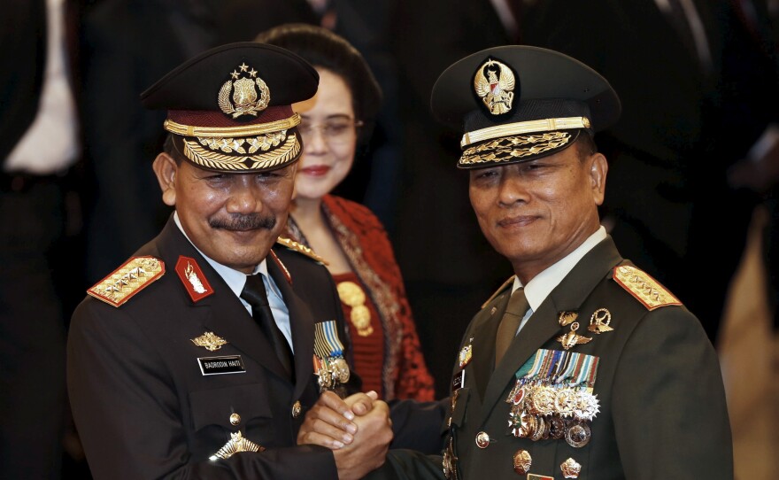 The head of Indonesia's Armed Forces General Moeldoko (right) congratulates the country's new National Police Chief Badrodin Haiti, last month. Moeldoko recently defended the Indonesian military's use of virginity tests for female recruits.