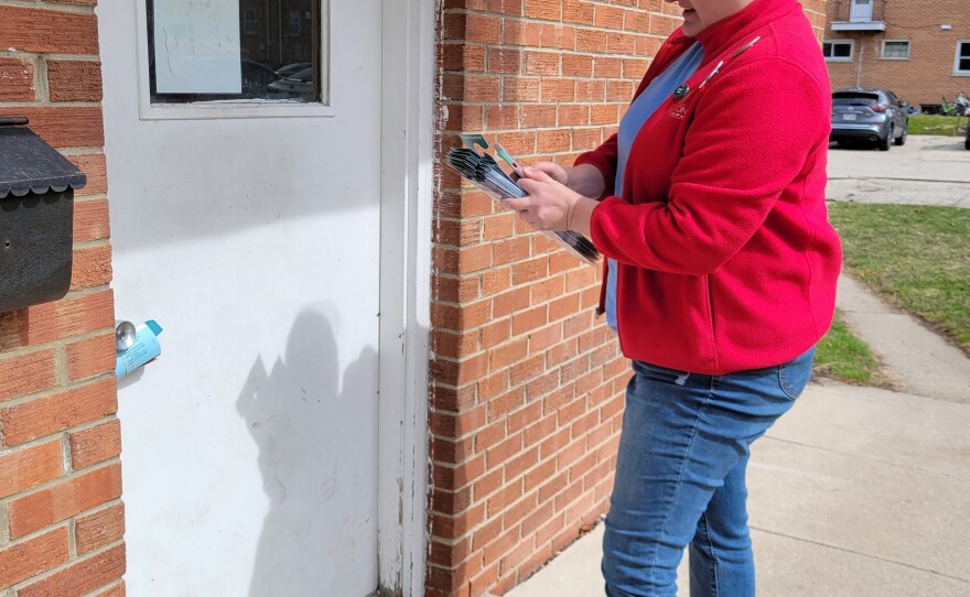 Sarah Harrison knocks on doors for Democrats on March 17 in Waukesha, Wisc., working through a list of 29 addresses that the party database said were home to likely Democratic voters.