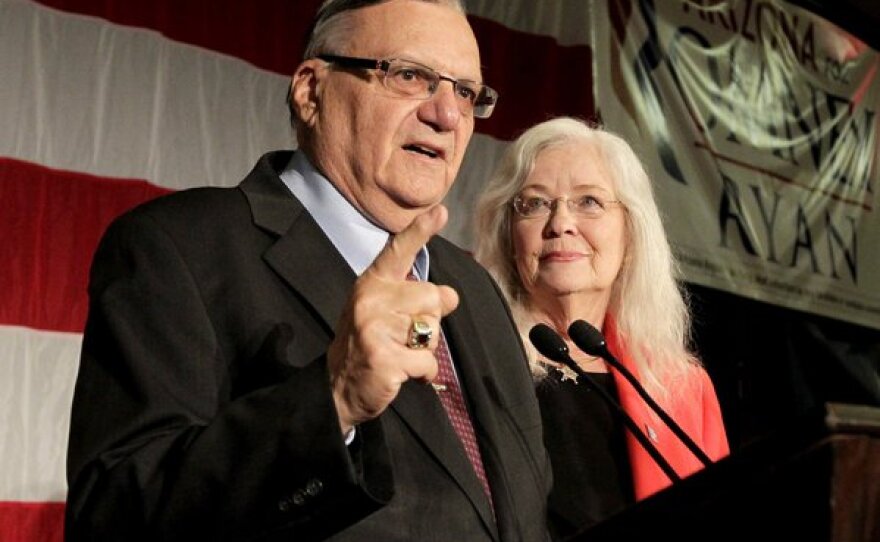 Maricopa County Sheriff Joe Arpaio with his wife, Ava, speaks to supporters during an Election Night party in Phoenix.