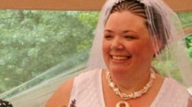 Lisa Lunt at her  wedding reception shortly after she got married in Massachusetts in 2008.   She and her wife have since split up, but are unable to divorce as their  home state of Rhode  Island doesn't recognize their marriage.