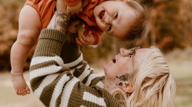 Sierra Smith holds her son, Travis, whose deafness was successfully treated with gene therapy.