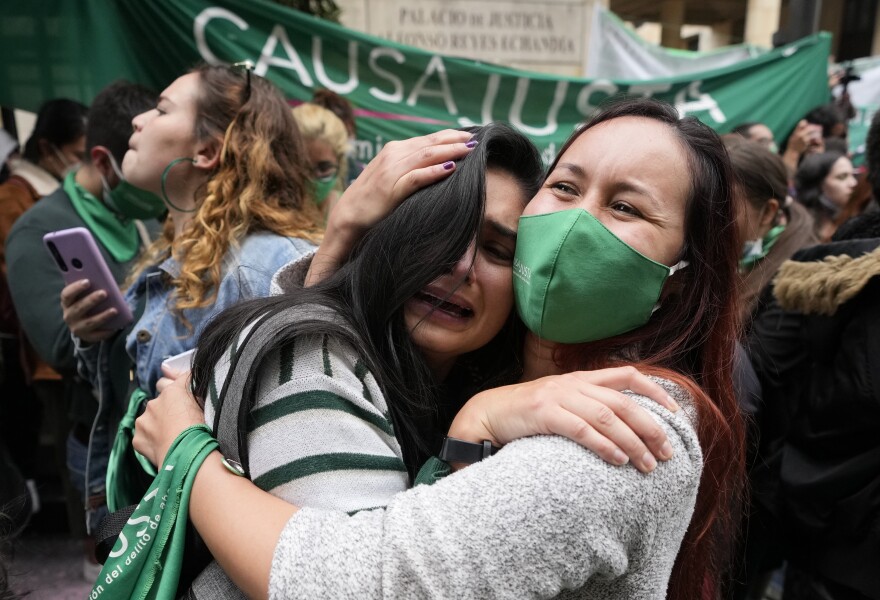 Abortion-rights activists celebrate after the Constitutional Court approved the decriminalization of abortion, lifting all limitations on the procedure until the 24th week of pregnancy, in Bogota, Colombia, Monday, Feb. 21, 2022.
