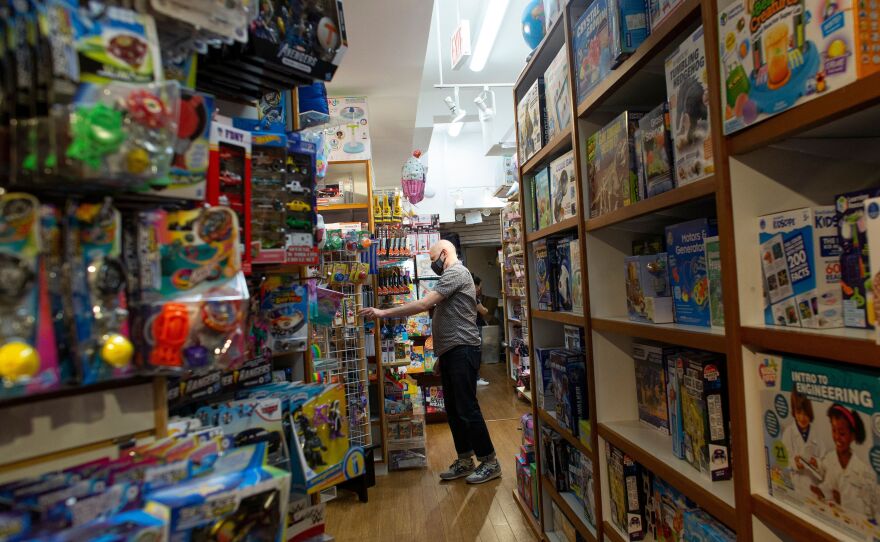 An employee organizes an aisle at Mary Arnold Toys, New York City's oldest toy store, on Aug. 2.