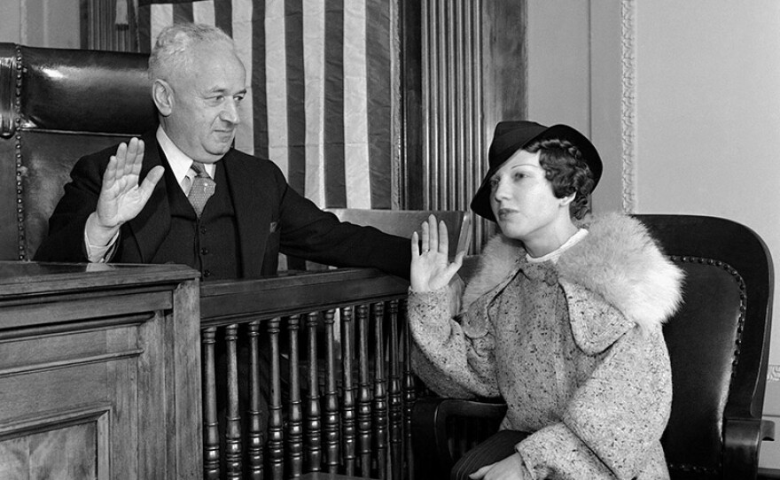 Ann Cooper Hewitt being sworn in before testifying to municipal judge Sylvain J. Lazarus, 1936.