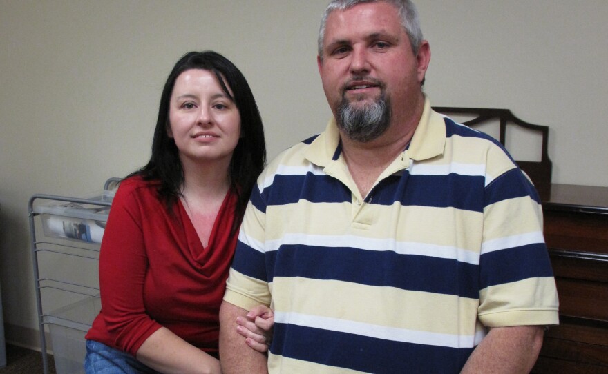 Thomas Vinson, an unemployed coal miner, with his wife, Angela. He says he's grateful for short-term federal help, but he's worried about his future.