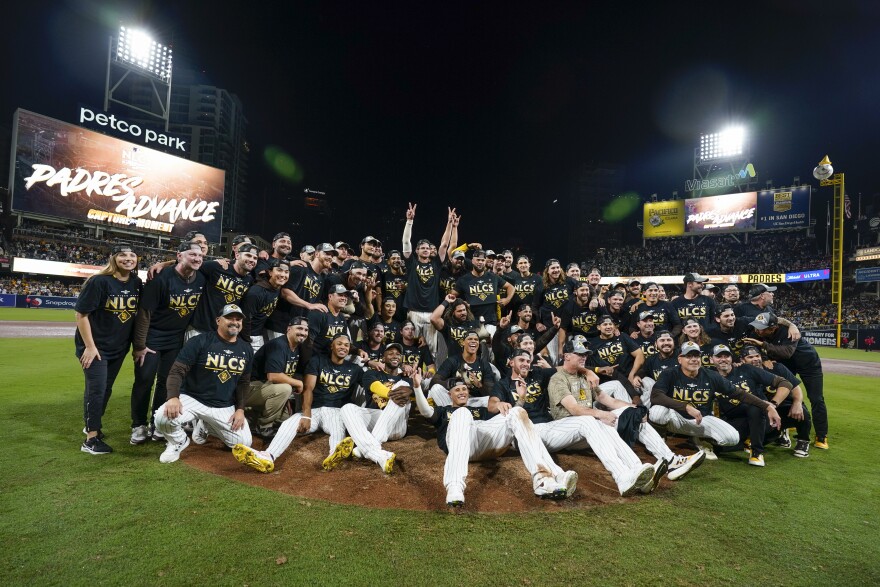 The San Diego Padres pose for a picture after defeating the Los Angeles Dodgers 5-3 in Game 4 of a baseball NL Division Series, Saturday, Oct. 15, 2022, in San Diego.