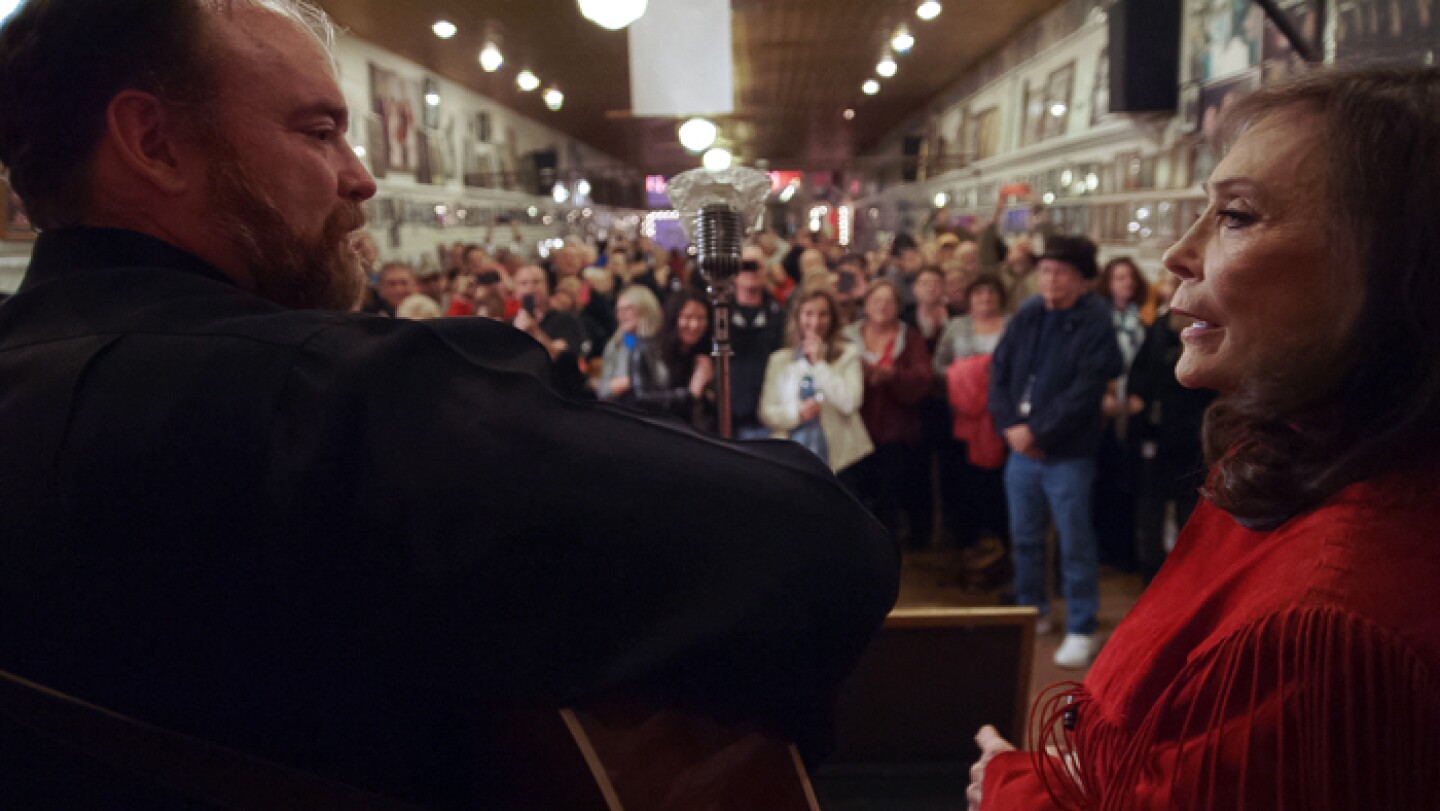 Loretta Lynn and John Carter Cash perfom at the Ernest Tubb Record Shop (Nashville, Tenn.) in AMERICAN MASTERS "Loretta Lynn: Still A Mountain Girl."