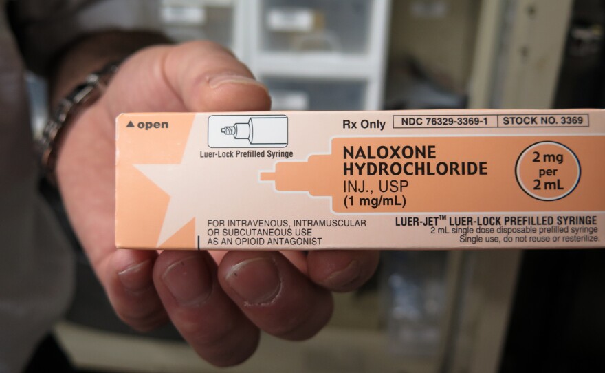 Paramedic Phil Salamone carries naloxone, a drug used to reverse an opioid overdose.