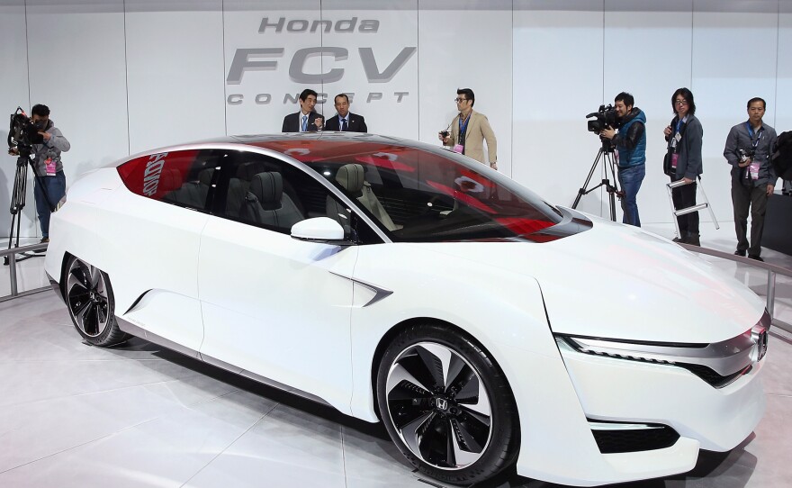Guests look over the Honda FCV fuel cell powered concept car during the media preview at the North American International Auto Show in Detroit.