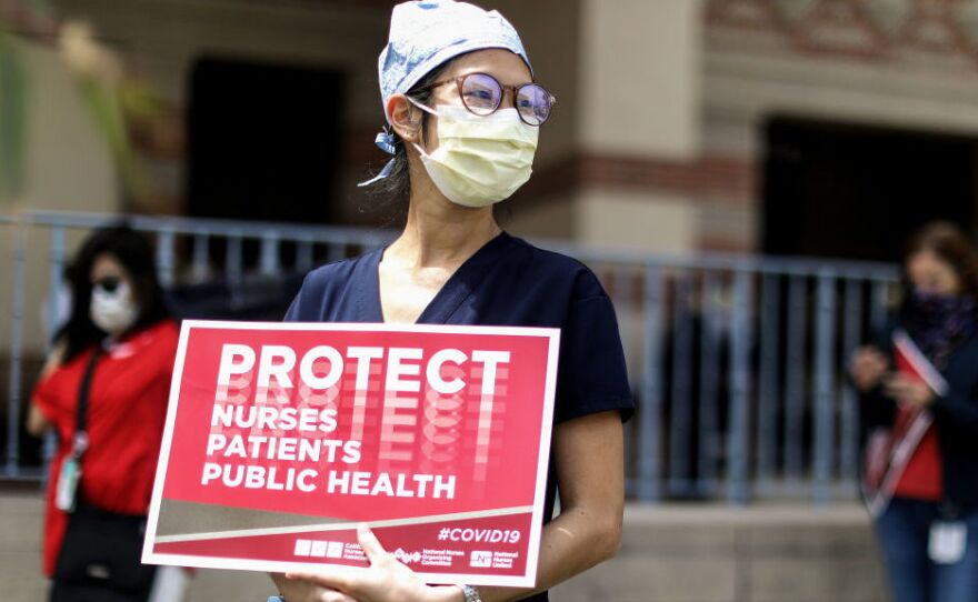 Registered nurses and other health care workers at UCLA Medical Center in Santa Monica, Calif., protest in April what they say was a lack of personal protective equipment for the pandemic's front-line workers.