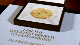 FILE - A Nobel diploma and medal are displayed, Dec. 8, 2020, during a ceremony in New York.