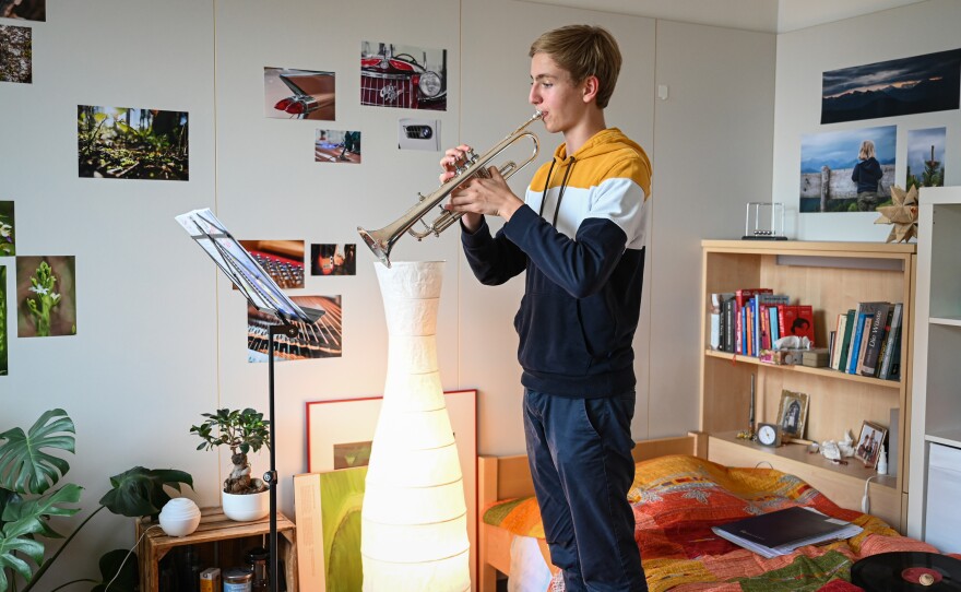 Maximilian Steiner practices his trumpet in his room at choir boarding school on July 15, 2021. He joined the school starting in first grade.