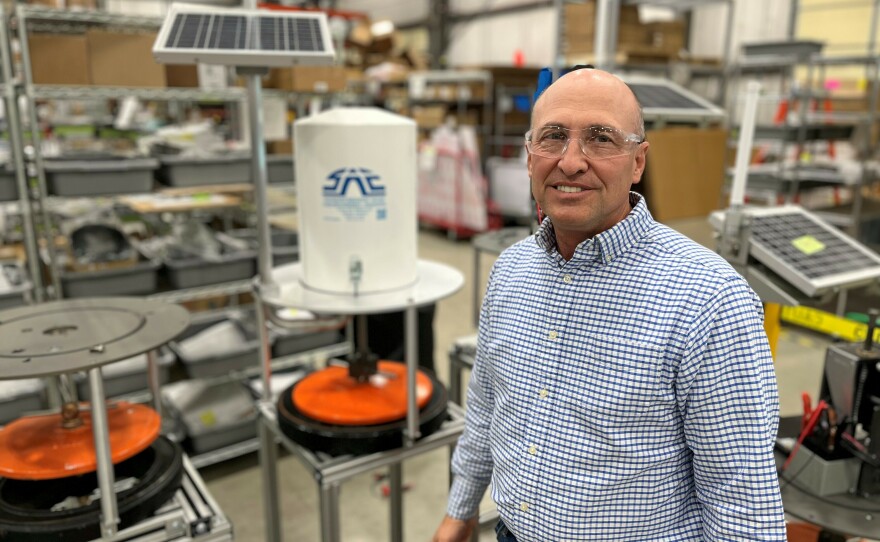 On a factory floor in Logan, Utah, farmer Clay Carter demonstrates his company's new irrigation technology that he says helped cut his water use in half.