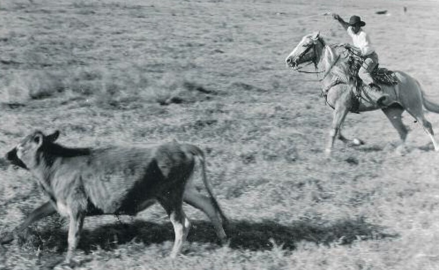 A caption from the exhibit: "Black cowboy at work on U.S. Sugar Corporation land near Clewiston, Florida, about 1947."