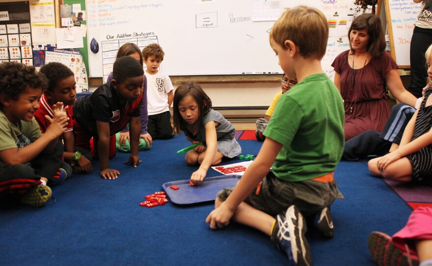 First graders at Black Pine Circle School in Berkeley, Calif., learn basic addition using dominos.