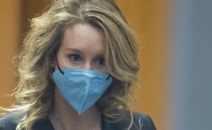 Elizabeth Holmes walks into federal court in San Jose, Calif.