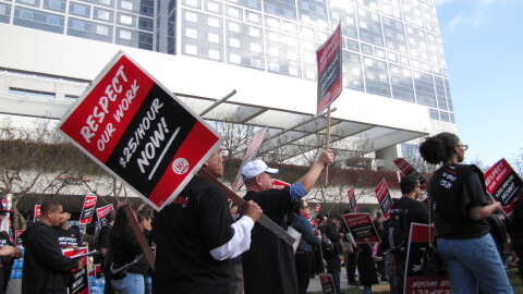 Hotel workers with Unite Here Local 30 rally outside the Hilton San Diego Bayfront in support of a $25 minimum hourly wage for service workers on Wednesday, May 1, 2024.