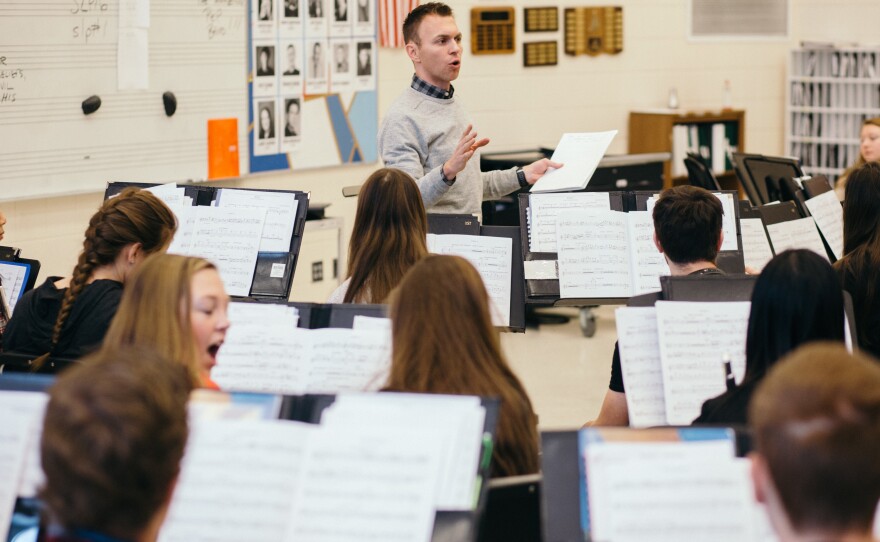 Band teacher Brian Lukkasson leads a discussion with his class about the perspectives of the composers they play, focusing on composers of color in the civil rights era.