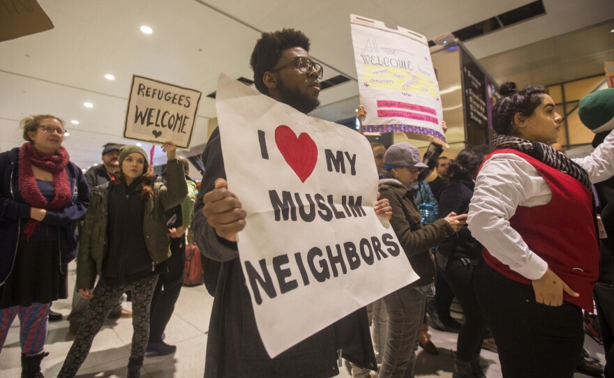 The mayor of Boston and Sen. Elizabeth Warren were among the protesters at Boston's Logan International Airport.