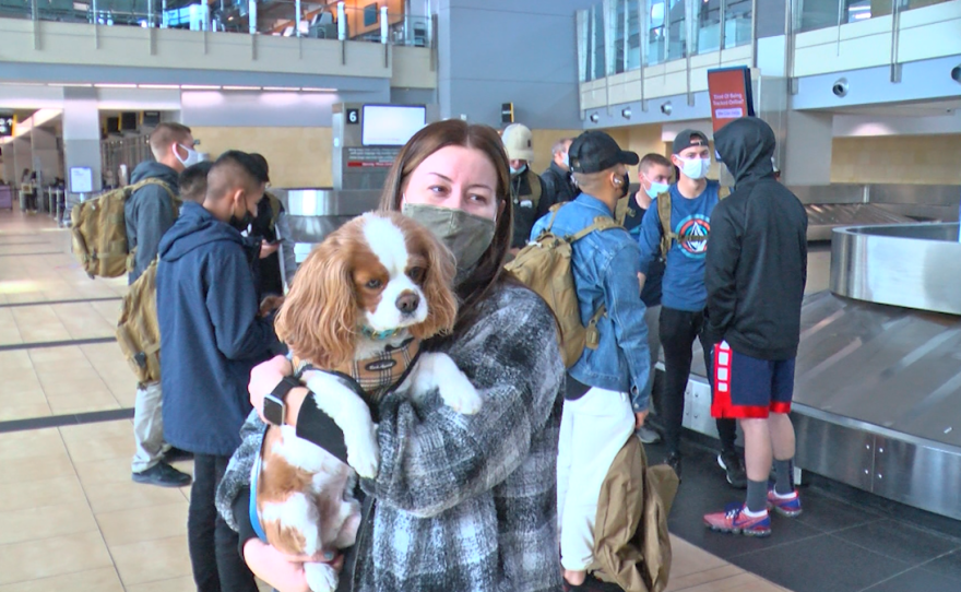 Passenger and dog arrive at the San Diego International Airport.png