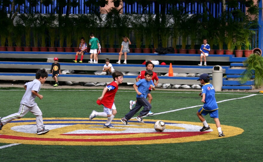 The author's son (center, in the red jersey) playing soccer in Mexico City.