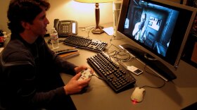 Todd Howard, the game director for Bethesda Softworks, plays <em>Fallout 3</em> in his office. He says the casual culture is one of the attractions of a career in the video game industry.