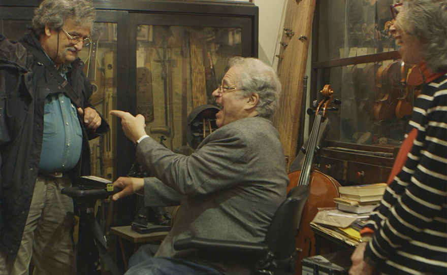 Itzhak and Toby Perlman with Israeli luthier Amnon Weinstein at his violin workshop.