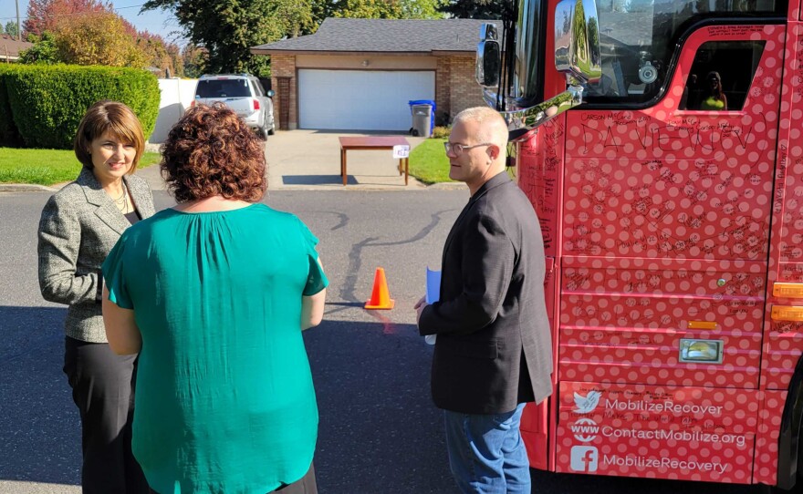 Addiction activist Ryan Hampton, right, meets with Republican Rep. Cathy McMorris Rogers, left, during a stop in Spokane, Wash.