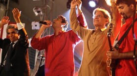 Laal performs in Karachi, Pakistan. Lead singer Shahram Azhar and guitarist Taimur Rahman take a curtain call with key leaders of Pakistan's lawyers' movement, Ali Ahmed Kurd (left) and Aitzaz Ahsan.