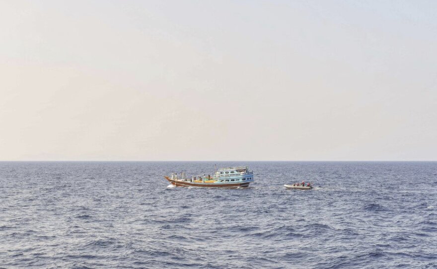 Sailors intercept a dhow Nov. 8 in the Gulf of Oman. The U.S. Navy says it found 70 tons of a missile fuel component hidden among bags of fertilizer aboard the ship, which was bound for Yemen from Iran. It's the first such seizure in Yemen's yearslong war, as a ceasefire there has broken down.