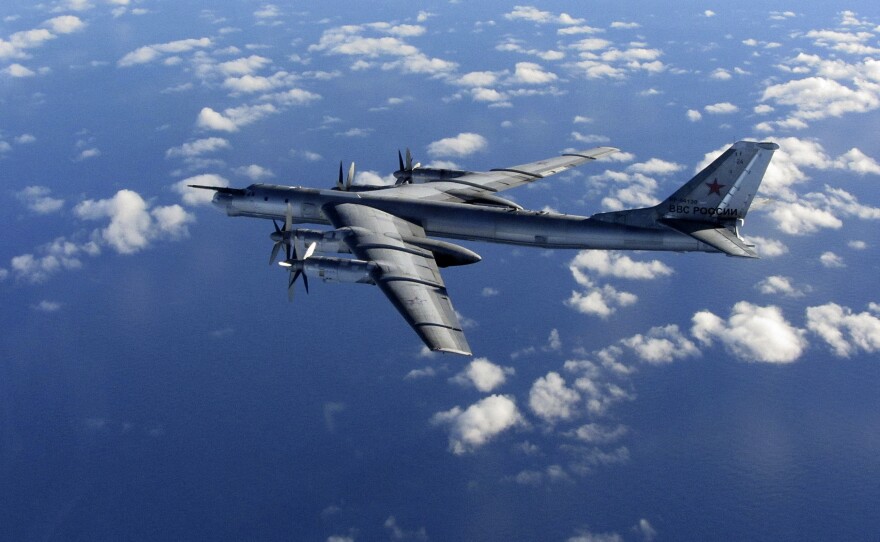 In this photo provided by Britain's Royal Air Force, taken Oct. 29, 2014, a Russian military long-range bomber aircraft photographed by an intercepting RAF Typhoon flies in international airspace.