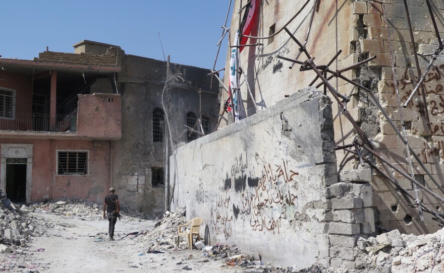 Graffiti on a wall in Mosul lists security forces who took back the city. The military plan to retake Mosul, agreed to between Iraq and the U.S., involved encircling ISIS, leaving the fighters no escape route once they were surrounded in the Old City. But it also left no escape for civilians trapped between ISIS gunmen and Iraqi and U.S. airstrikes.