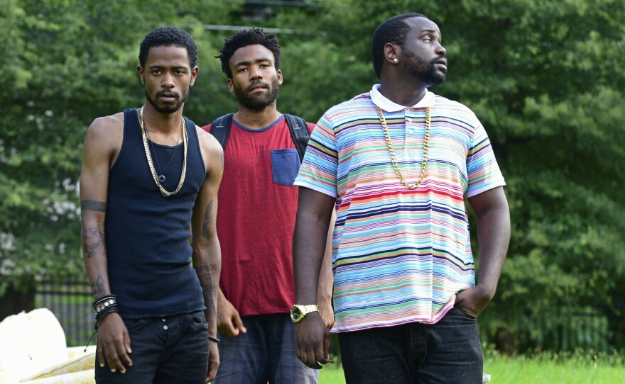 Lakeith Stanfield (left), Donald Glover (center) and Brian Tyree Henry in a still from Glover's series <em>Atlanta</em>, which depicts the life of a trap rapper and his cousin, an Ivy League dropout.