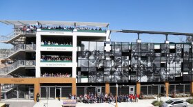 People who attended the dedication posed for a five-story group photo at San Diego Continuing Education's new Cesar Chavez car park in Barrio Logan. 