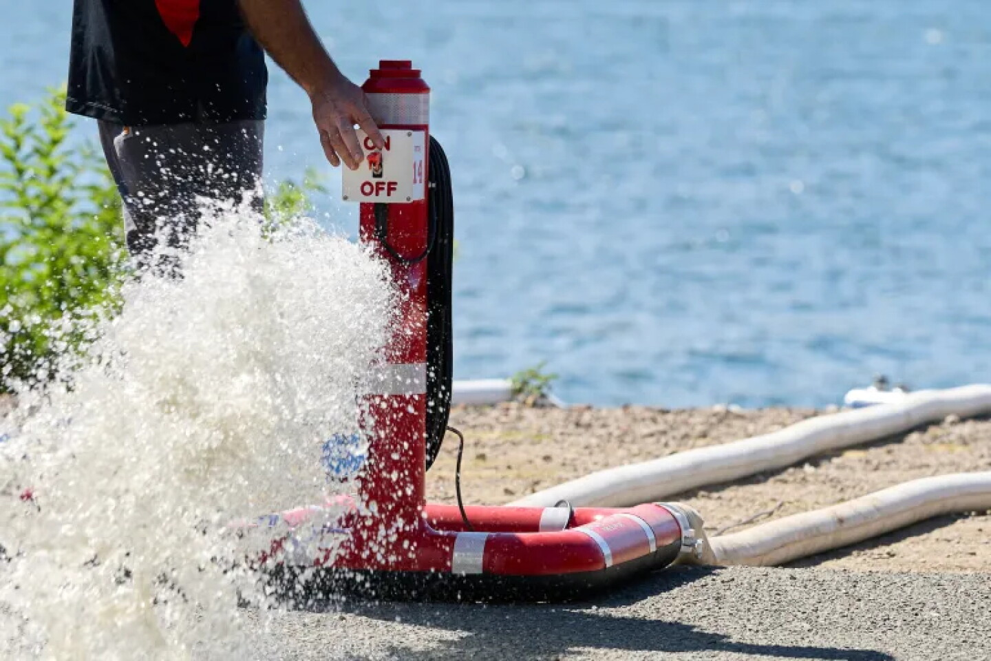 Remote hydrants are used in a training demonstration for fire crews on the shore of Clear Lake in Clearlake Oaks on Aug. 27, 2026.
