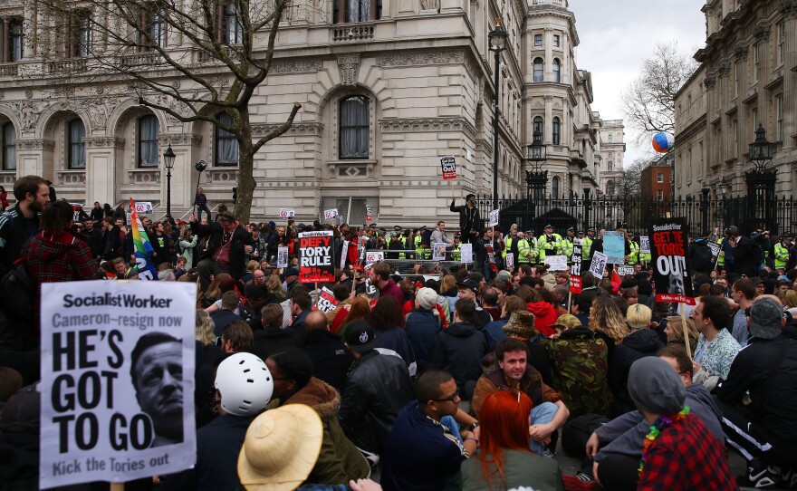 Demonstrators rally outside Downing Street Saturday in London.