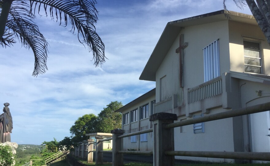 The office and residence of the Archbishop of Agana in Guam, seen Wednesday. The house was listed as one of the non-essential properties owned by the Catholic Church in the U.S. territory, which announced that it will file for bankruptcy.