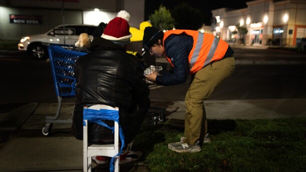 A volunteer conducts the Point-in-Time survey with a person experiencing homelessness in Escondido, Calif. January 30, 2025