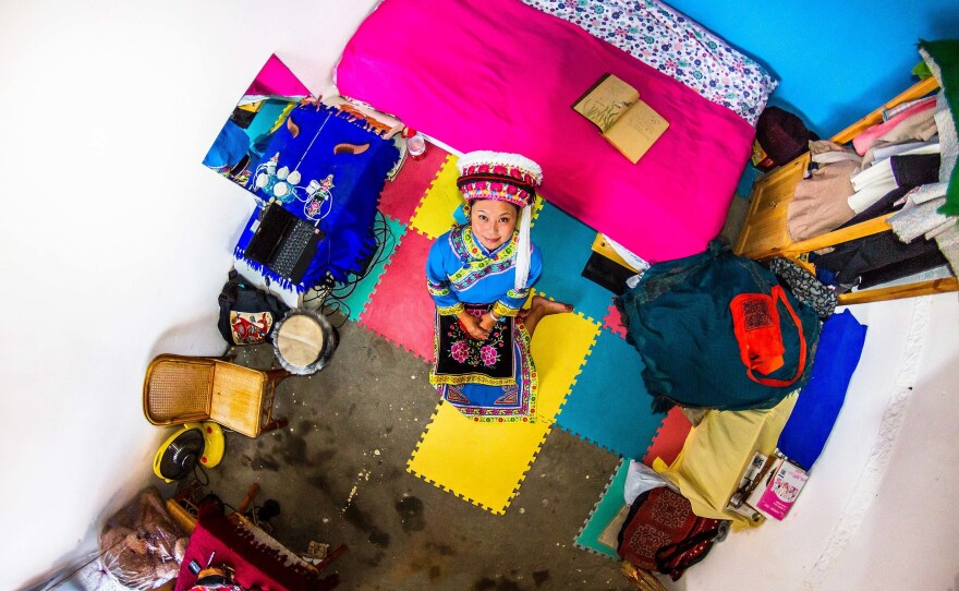 Yuan, 22, in her bedroom in Dali, China.