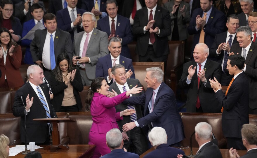 Rep. Kevin McCarthy, R-Calif., is congratulated after winning the 15th vote in the House chamber as the House enters the fifth day trying to elect a speaker.